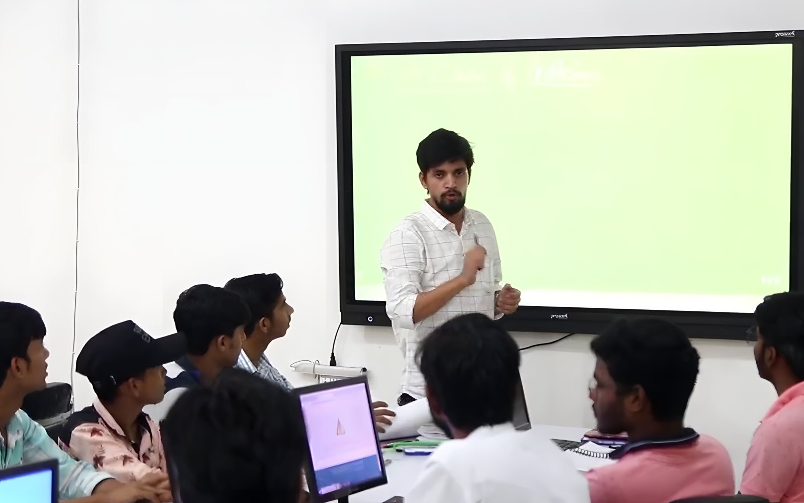 Students learning with a teacher